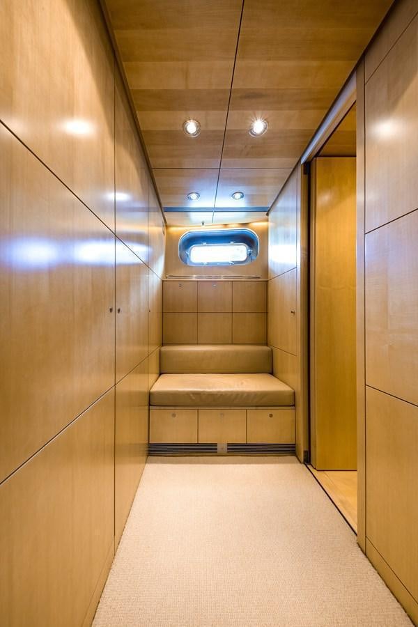 a hallway with a chair aboard SPIIP Yacht for Sale