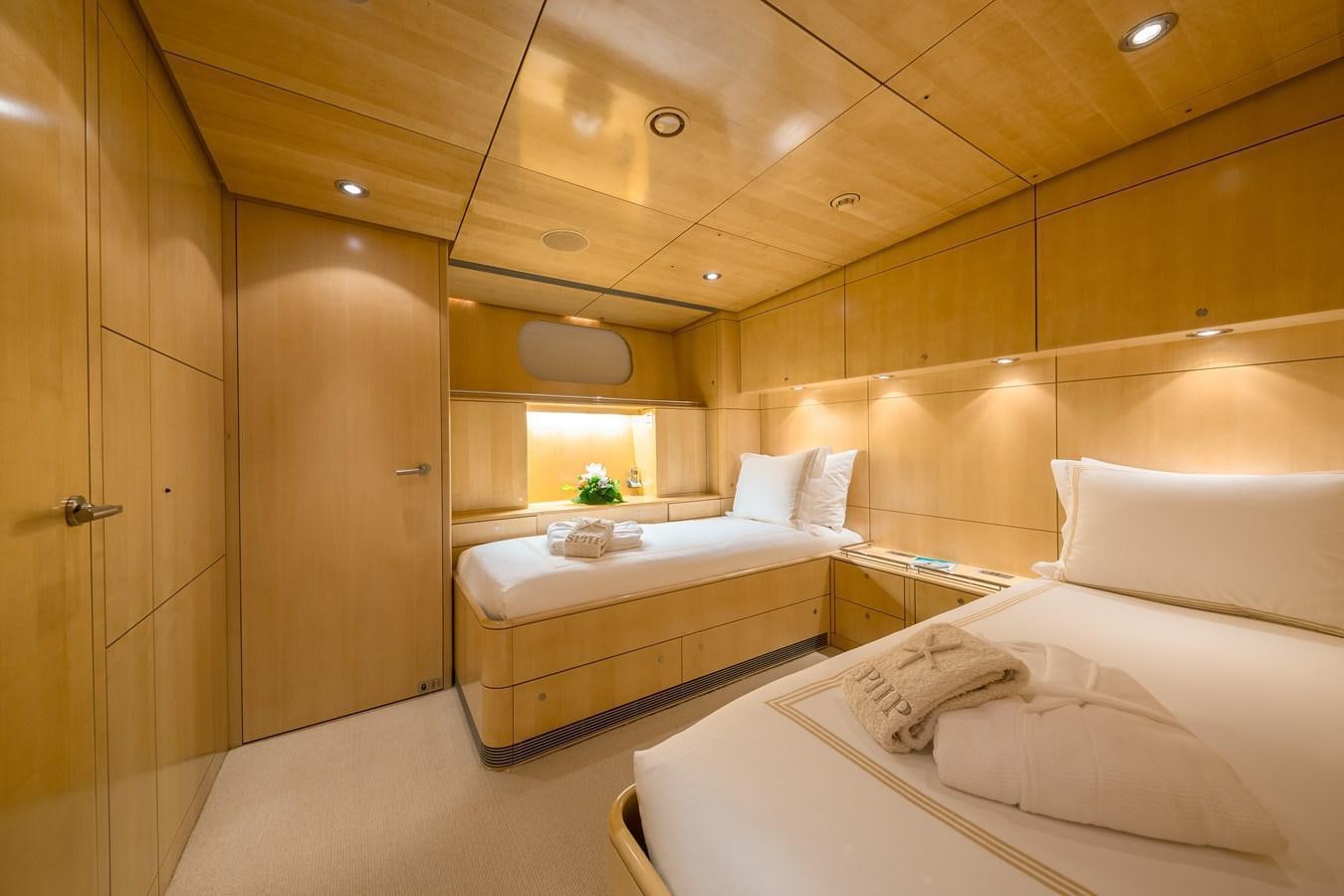 a room with a bed and a sink aboard SPIIP Yacht for Sale