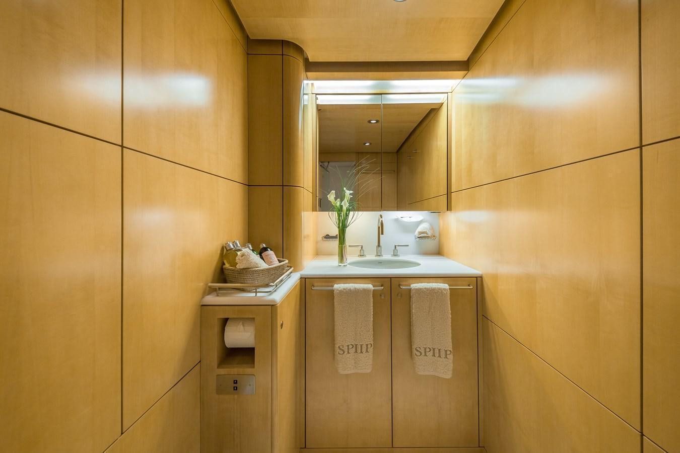 a bathroom with a sink and cabinets aboard SPIIP Yacht for Sale