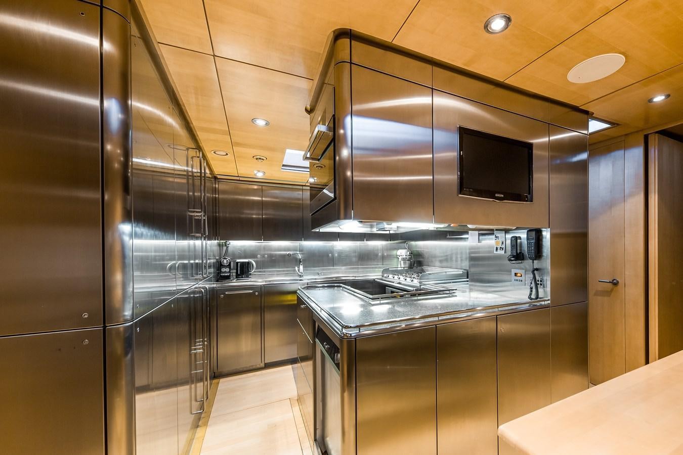 a kitchen with a large glass wall aboard SPIIP Yacht for Sale