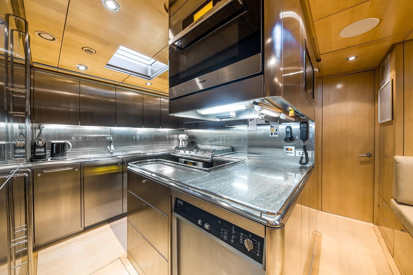 a kitchen with stainless steel appliances aboard SPIIP Yacht for Sale