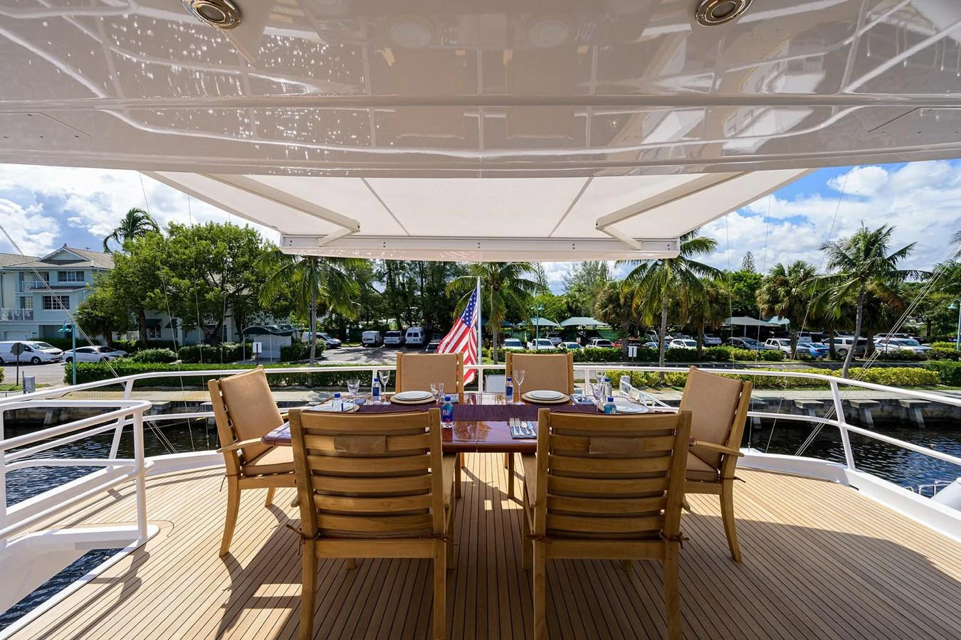 a patio with tables and chairs aboard TEMPO REALE Yacht for Sale