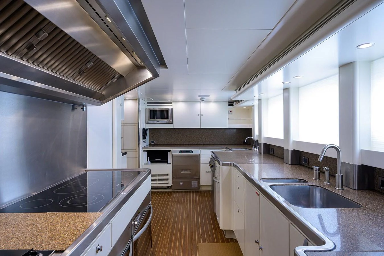 a kitchen with a large island aboard TEMPO REALE Yacht for Sale