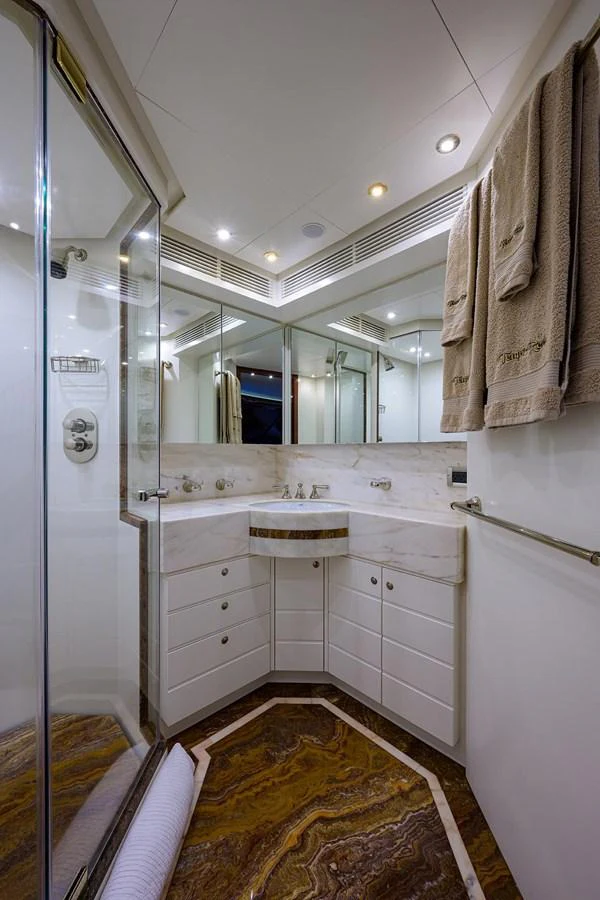 a bathroom with a sink and a mirror aboard TEMPO REALE Yacht for Sale
