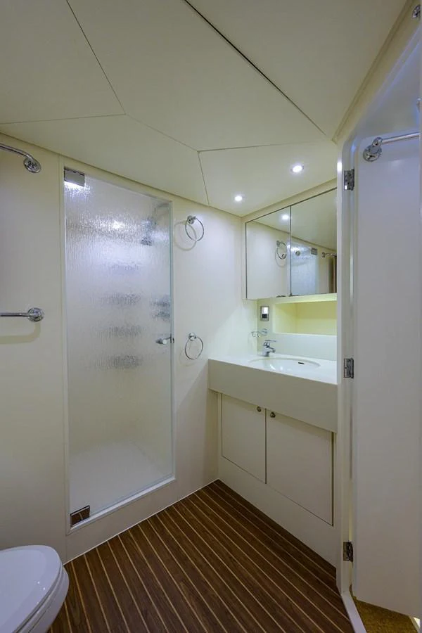 a bathroom with a shower and sink aboard TEMPO REALE Yacht for Sale