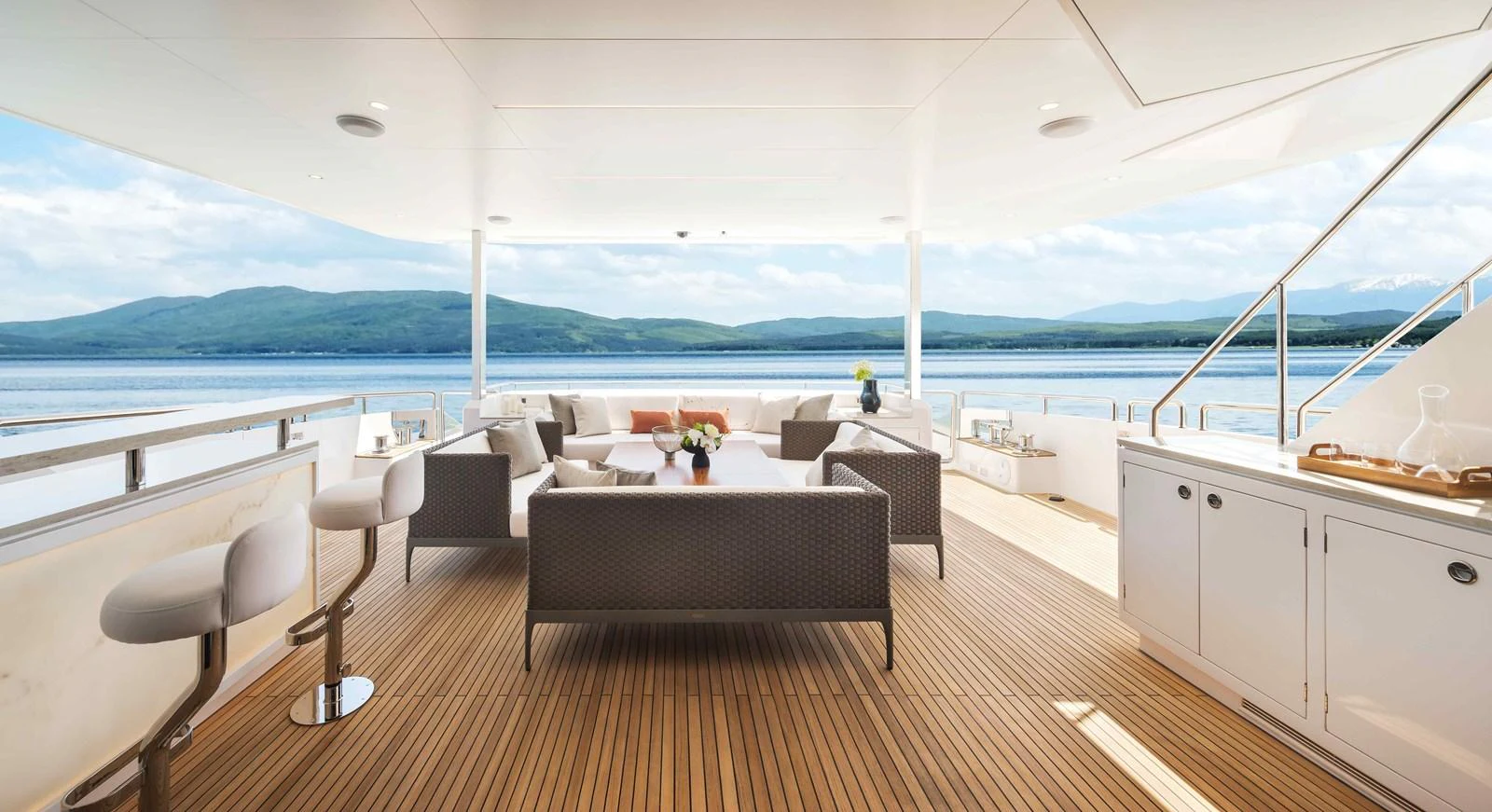 a room with a table and chairs aboard FD110-004 NEW ARRIVAL Yacht for Sale