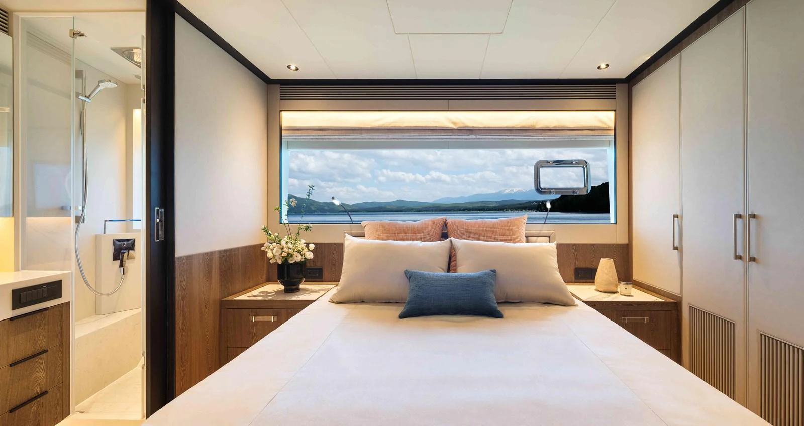 a bed with a large window aboard FD110-004 NEW ARRIVAL Yacht for Sale