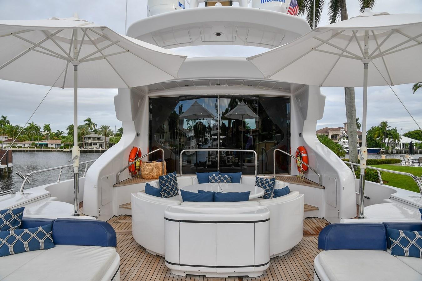 a cabana with a table and chairs aboard EYE PLAY Yacht for Sale