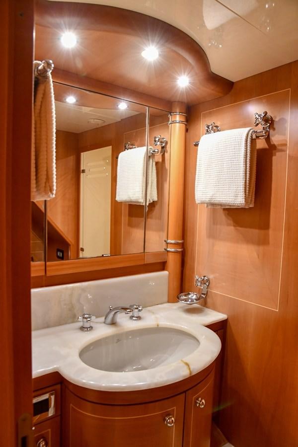 a bathroom with a sink and a mirror aboard EYE PLAY Yacht for Sale