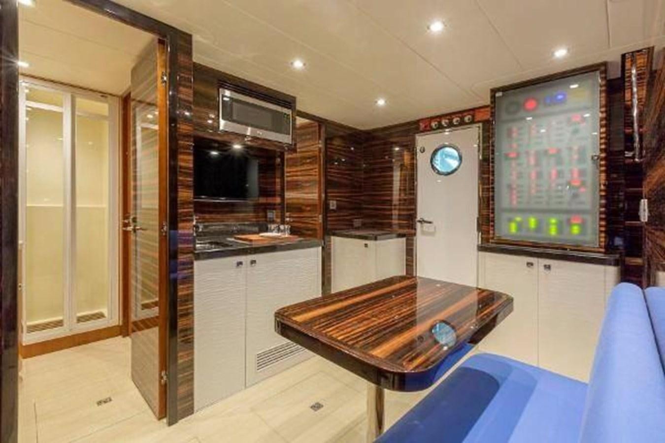 a kitchen with a table and a tv aboard HAMPTON EURO 830 Yacht for Sale