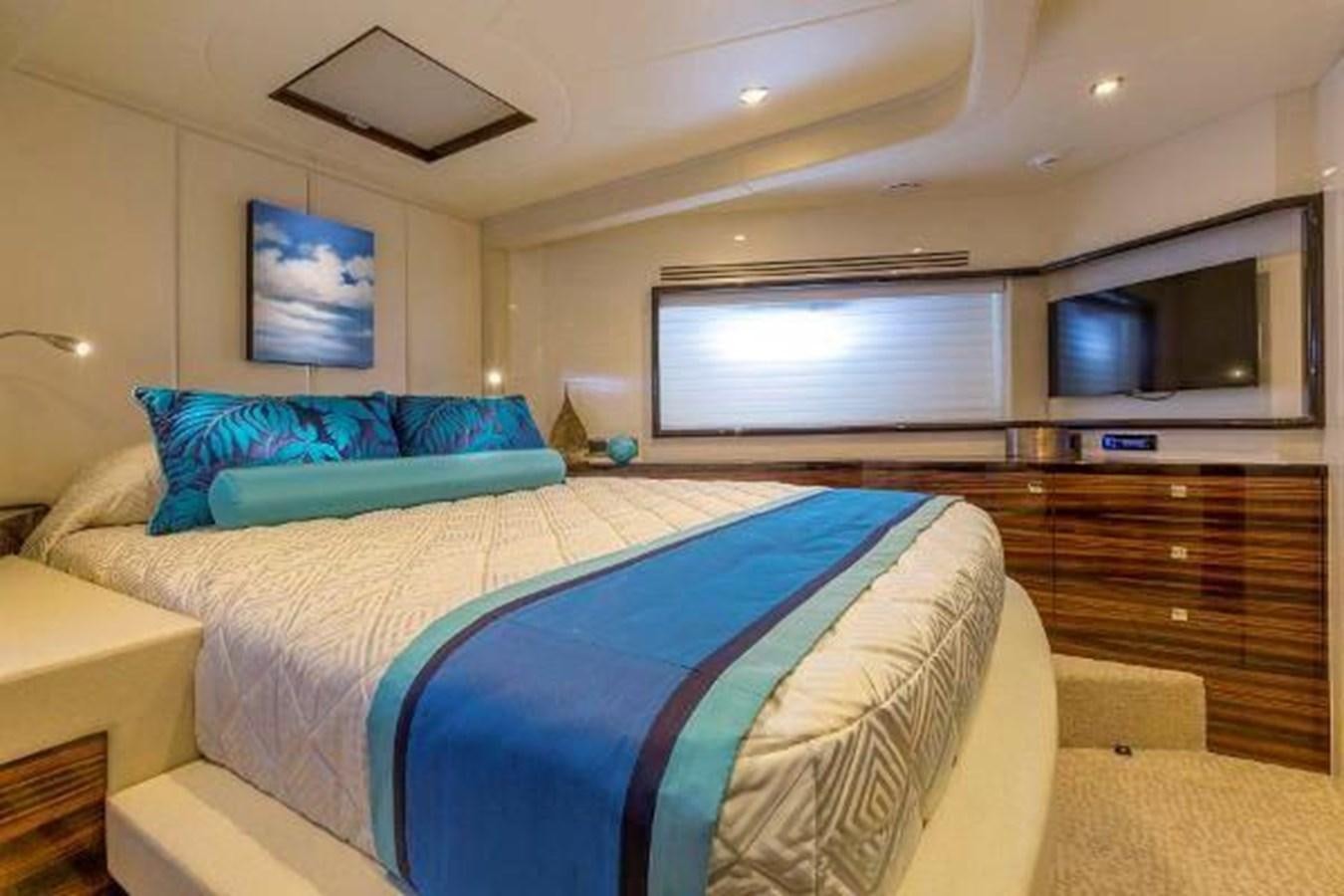 a bedroom with a bed and a tv on the wall aboard HAMPTON EURO 830 Yacht for Sale