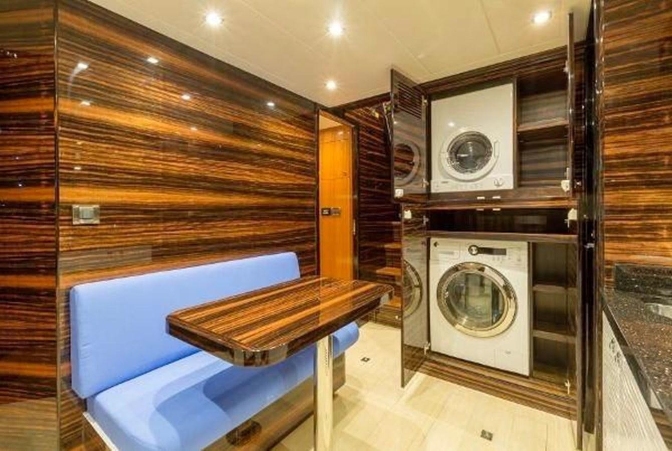 a kitchen with a washing machine and a table aboard HAMPTON EURO 830 Yacht for Sale