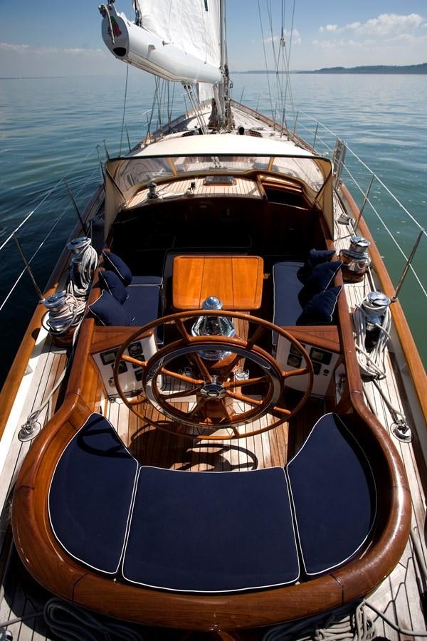 a boat with a steering wheel aboard COPIHUE Yacht for Sale