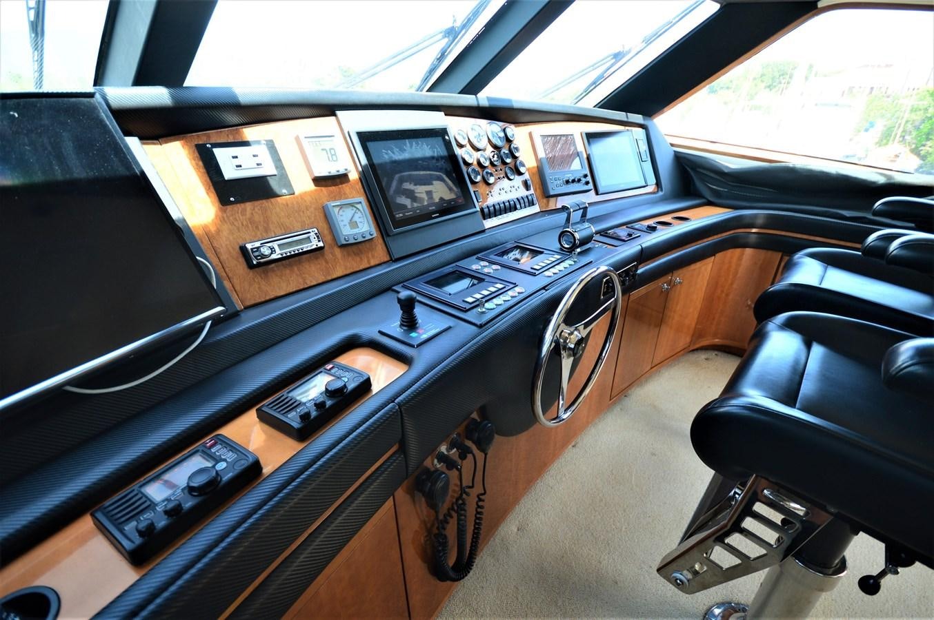 a table with electronic devices on it aboard GABBY MILAN 2 Yacht for Sale