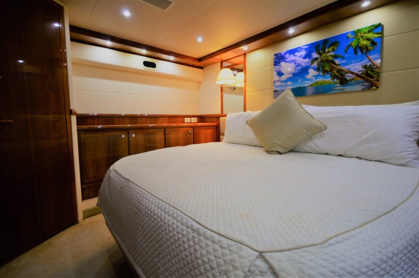 a bed with a white sheet aboard GABBY MILAN 2 Yacht for Sale