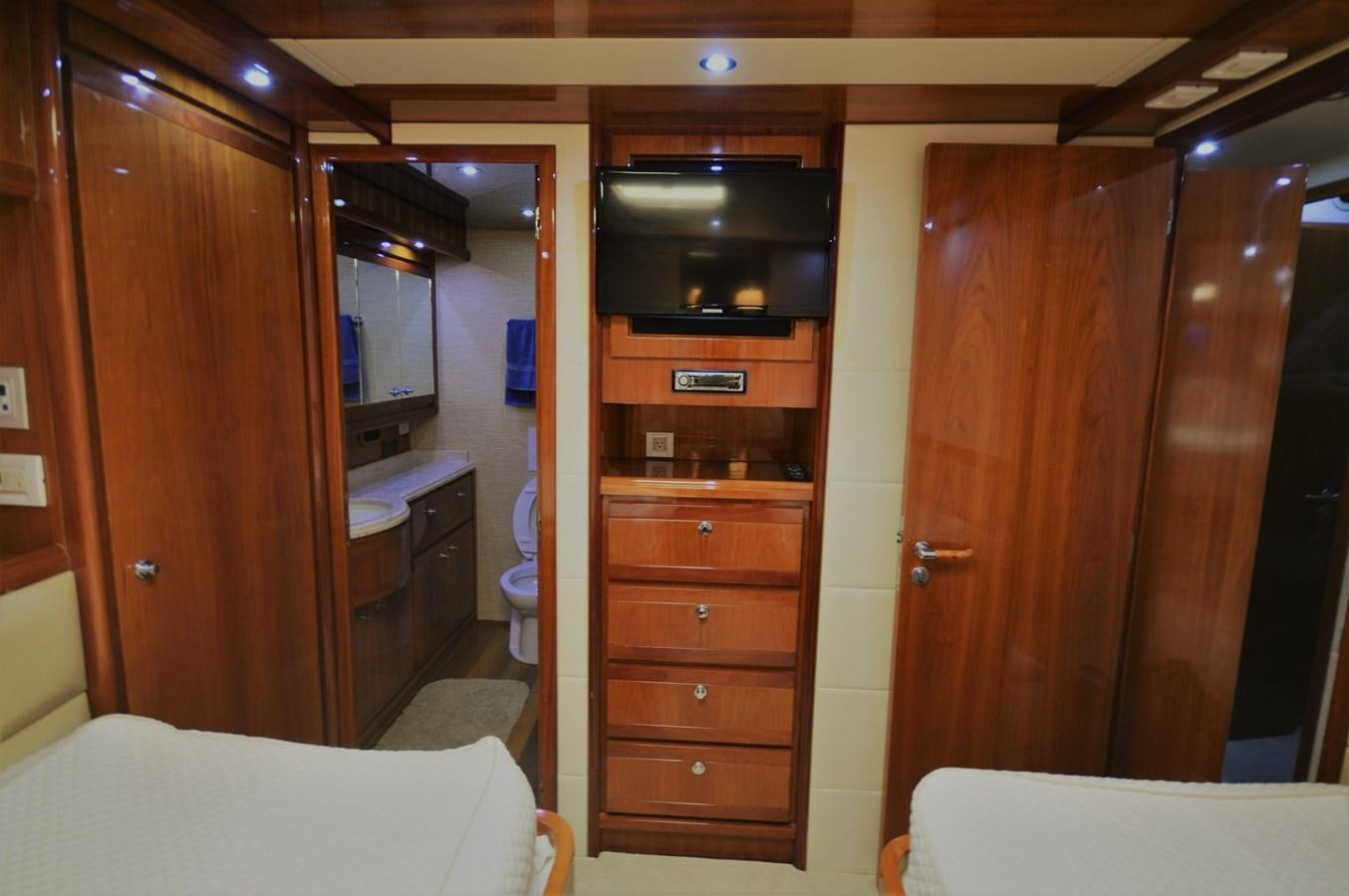 a room with a wood cabinet and a television aboard GABBY MILAN 2 Yacht for Sale