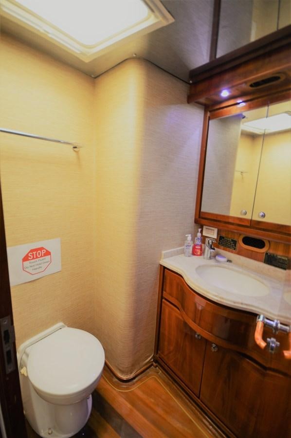 a bathroom with a toilet and a sink aboard GABBY MILAN 2 Yacht for Sale