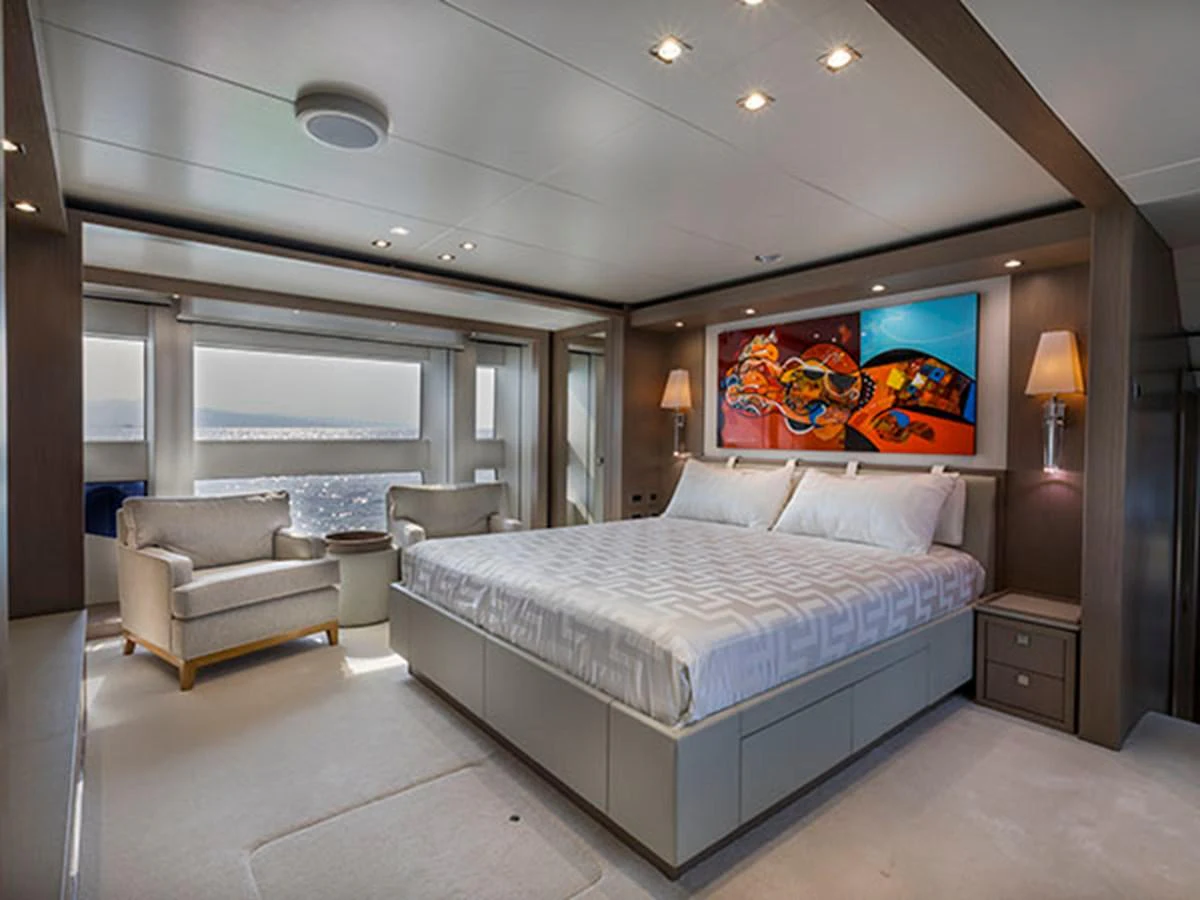 a large bedroom with a large bed aboard FREEDOM Yacht for Sale
