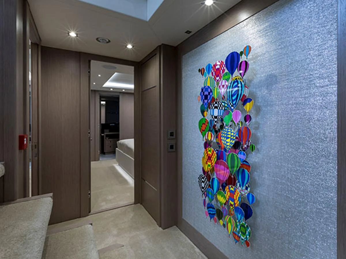 a hallway with a painting on the wall aboard FREEDOM Yacht for Sale
