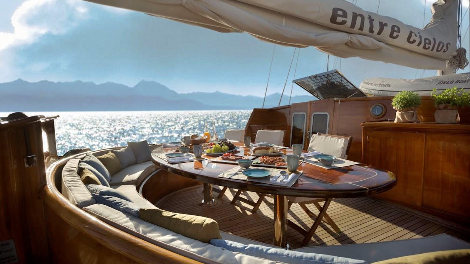 a room with a table and chairs aboard ENTRE CIELOS Yacht for Sale