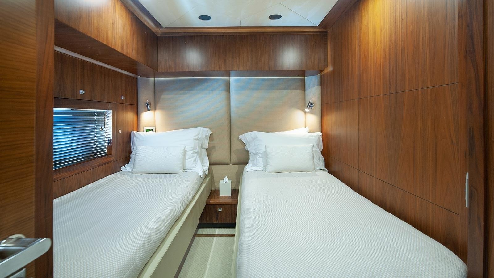 a room with two beds aboard BLADE 6 Yacht for Sale