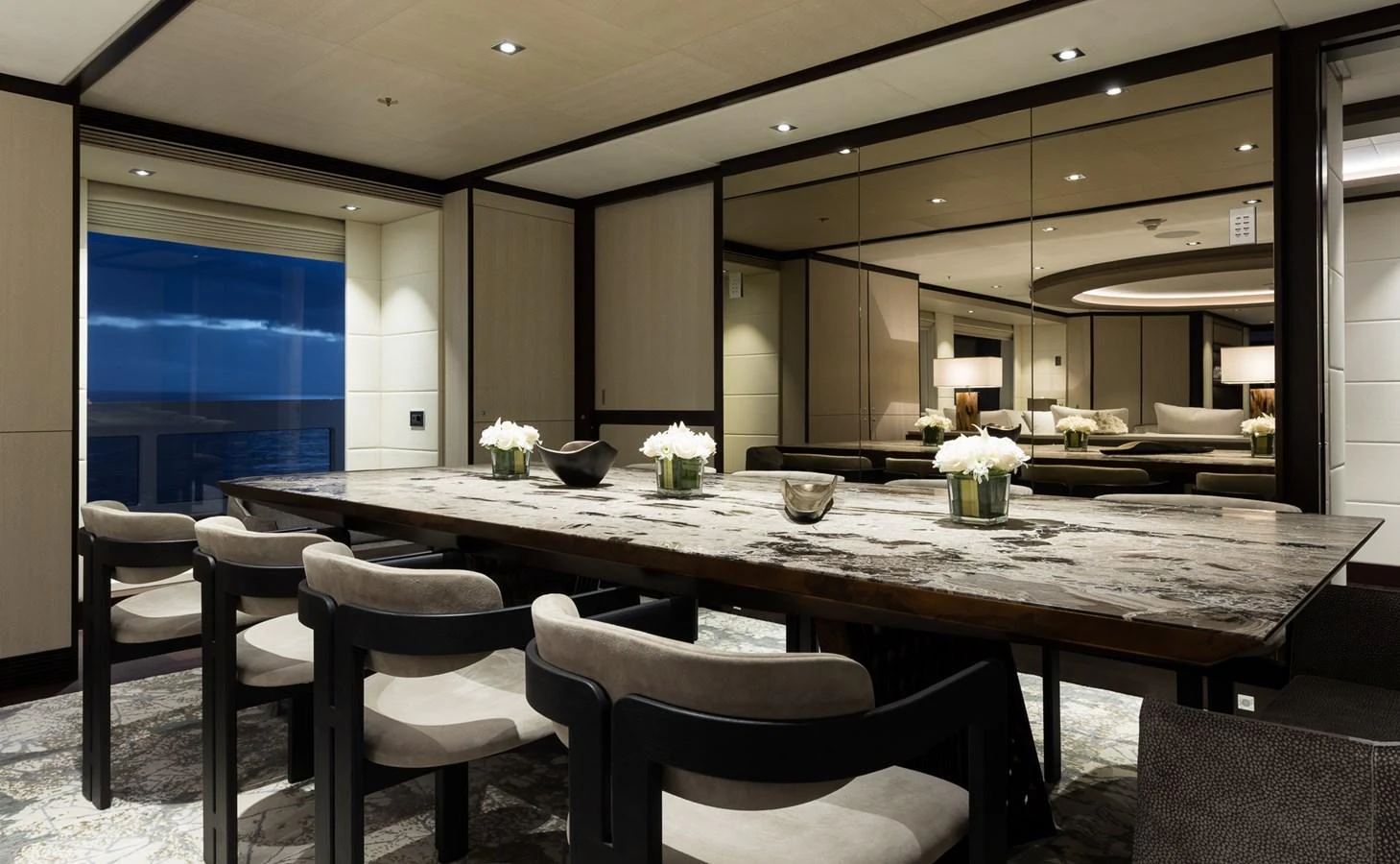 a large table with chairs around it aboard LAURENTIA Yacht for Charter