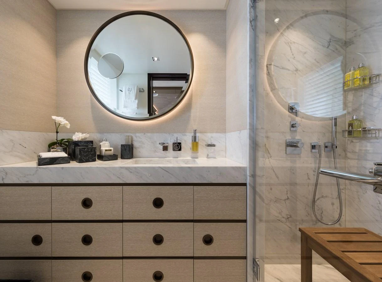 a bathroom with a large mirror aboard LAURENTIA Yacht for Charter