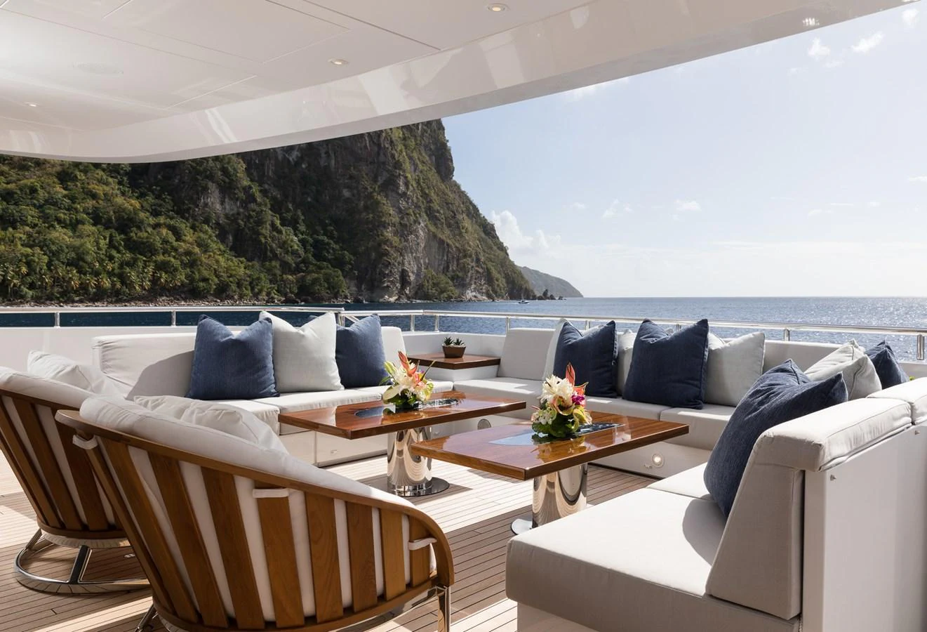 a room with a table and chairs aboard LAURENTIA Yacht for Charter