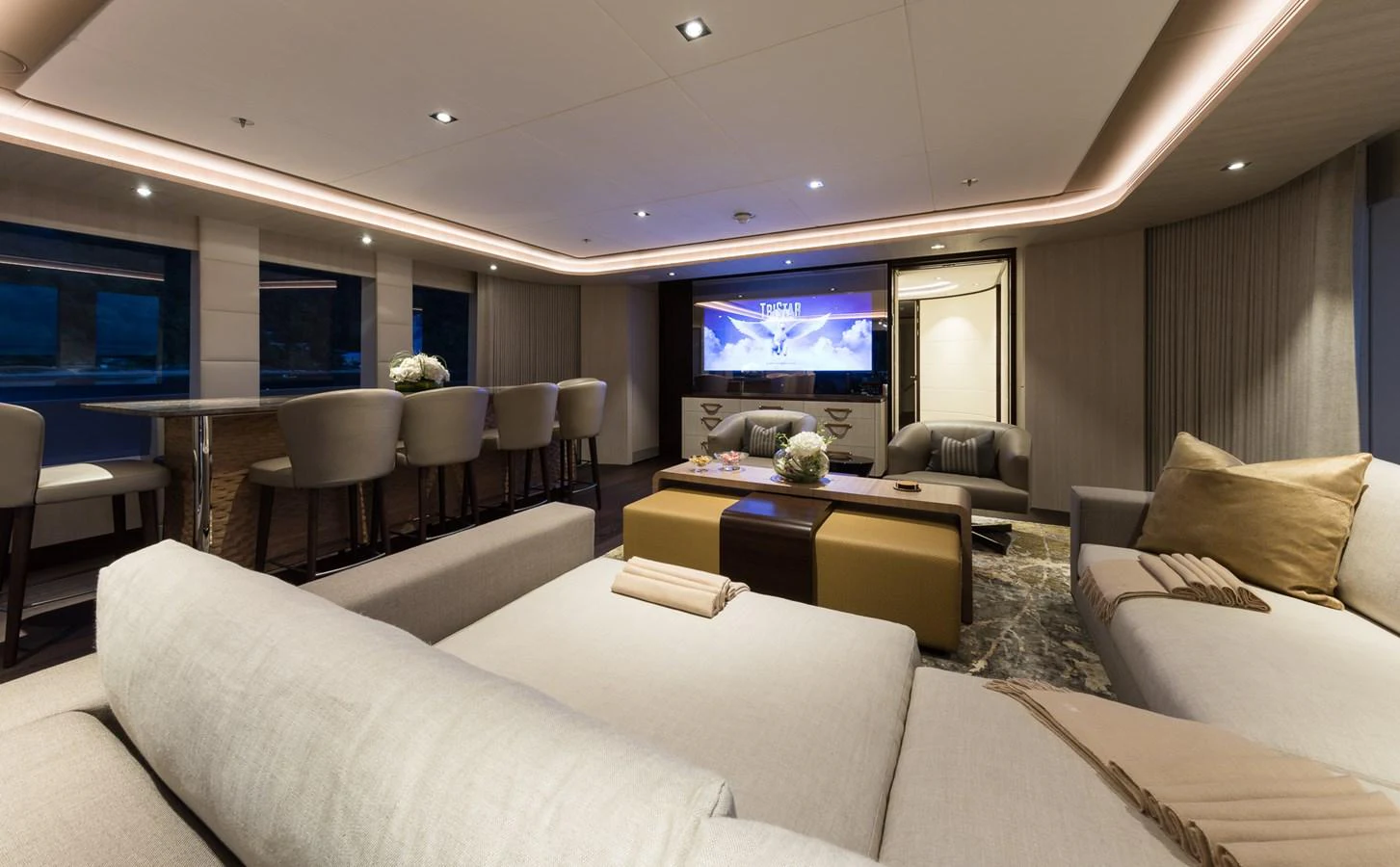 a living room with a large screen aboard LAURENTIA Yacht for Charter