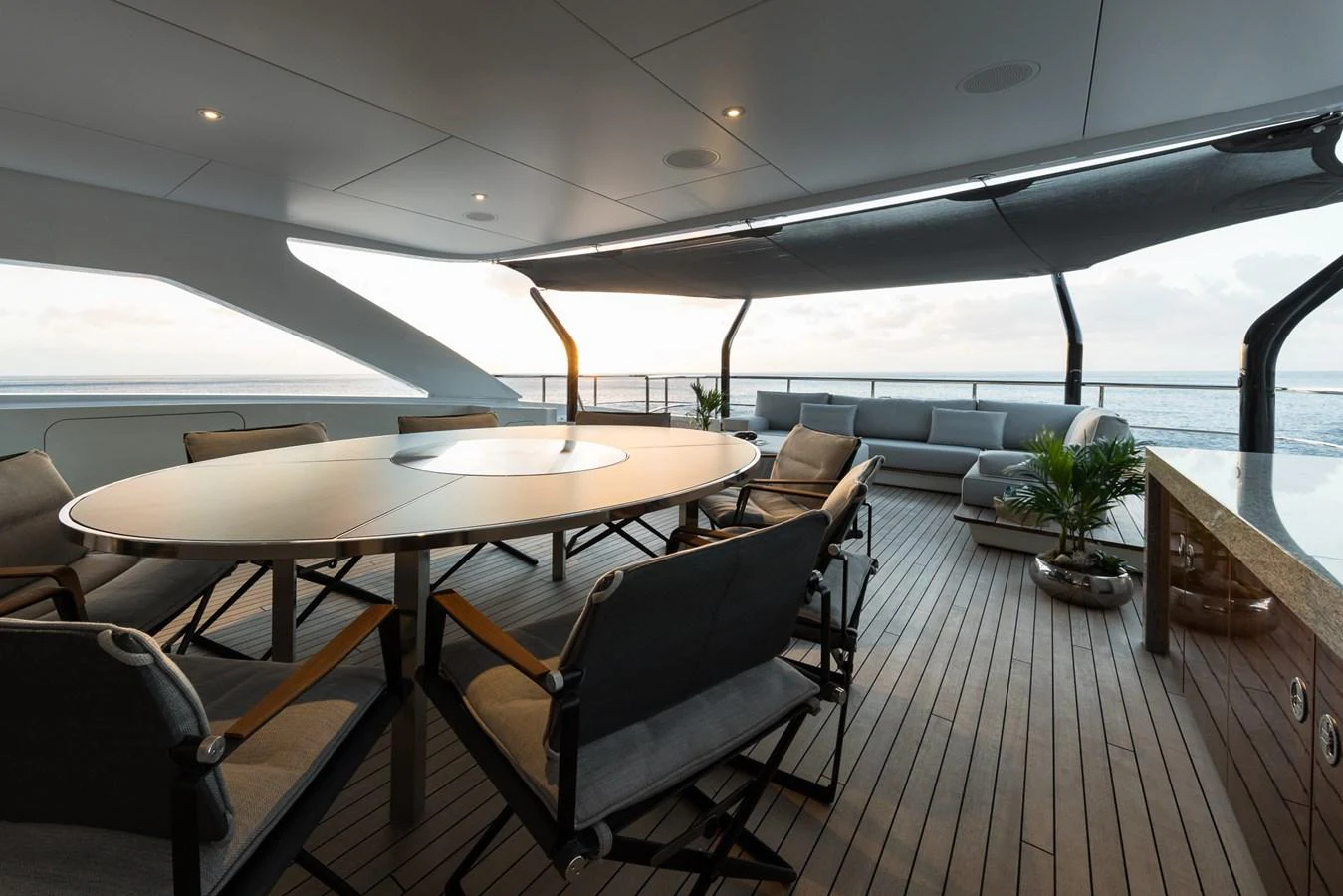 a room with a table and chairs aboard LAURENTIA Yacht for Charter
