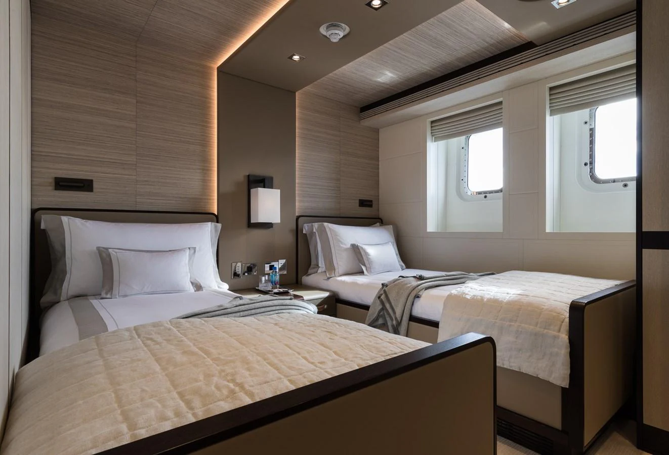 a couple of beds in a room aboard LAURENTIA Yacht for Charter