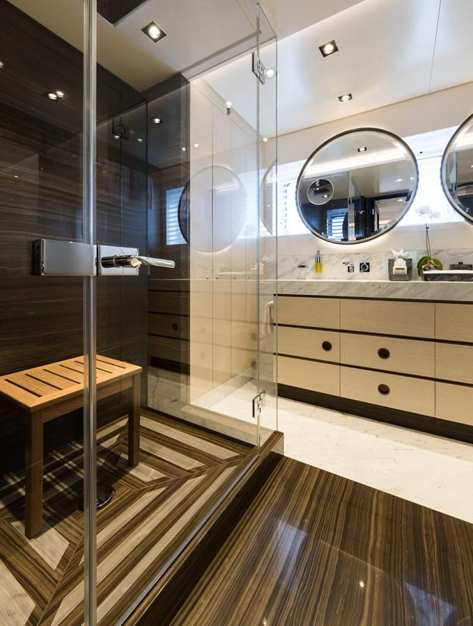 a bathroom with a large mirror aboard LAURENTIA Yacht for Charter