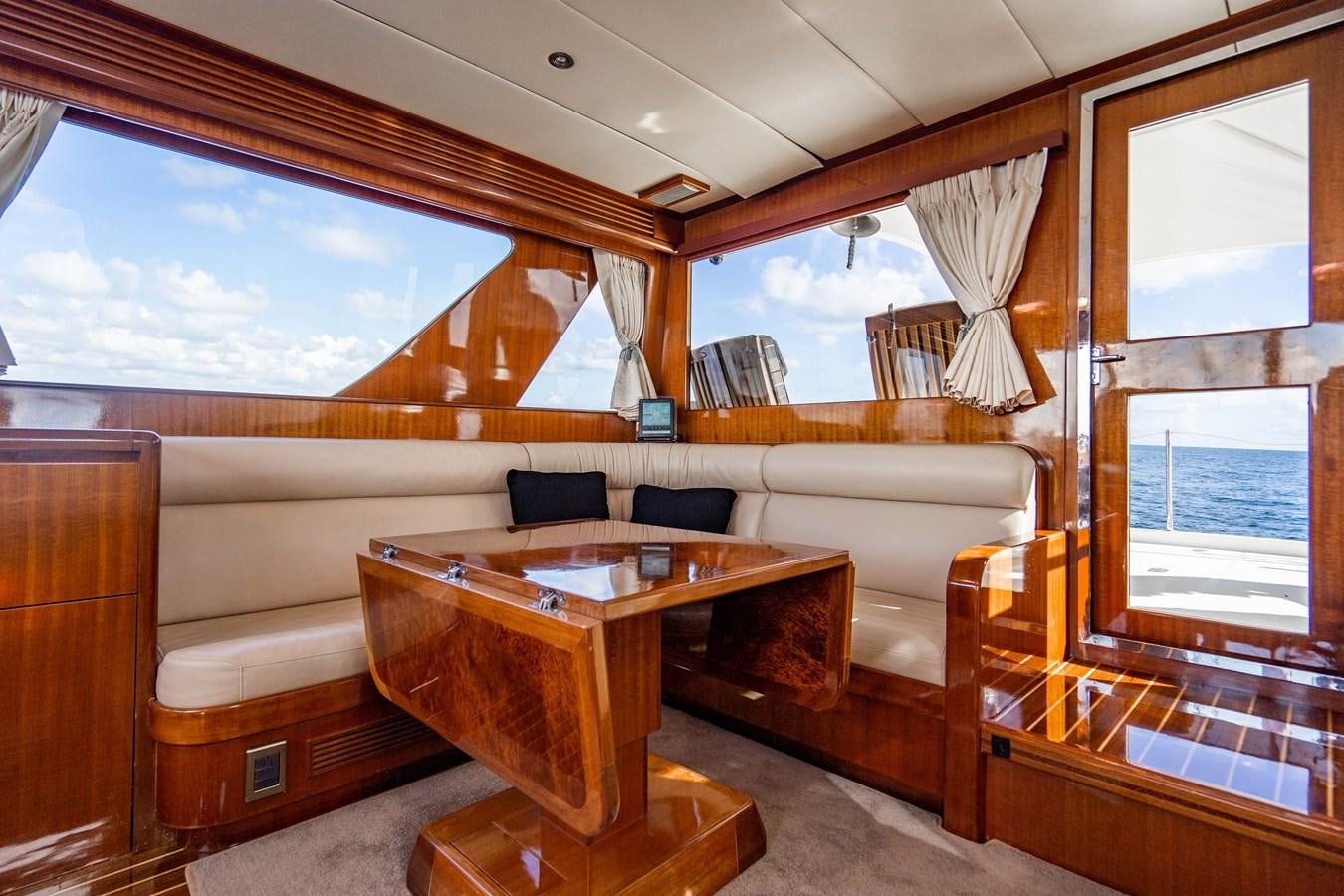 a room with a couch and a table aboard Miss Penny Yacht for Sale