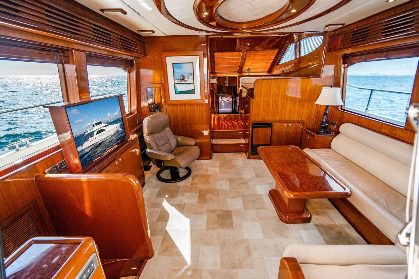 a living room with a large screen aboard Miss Penny Yacht for Sale