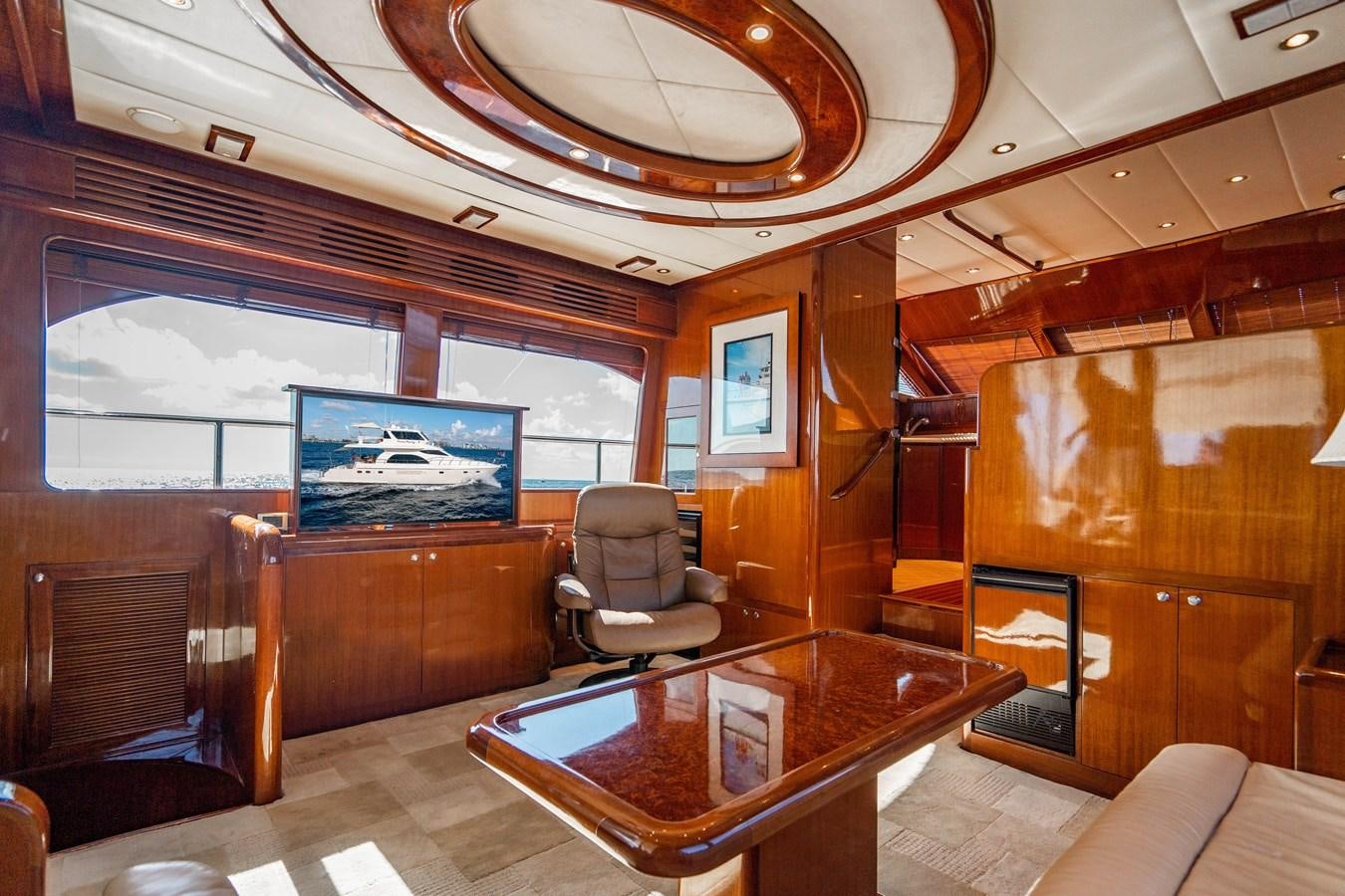 a room with a table and chairs aboard Miss Penny Yacht for Sale