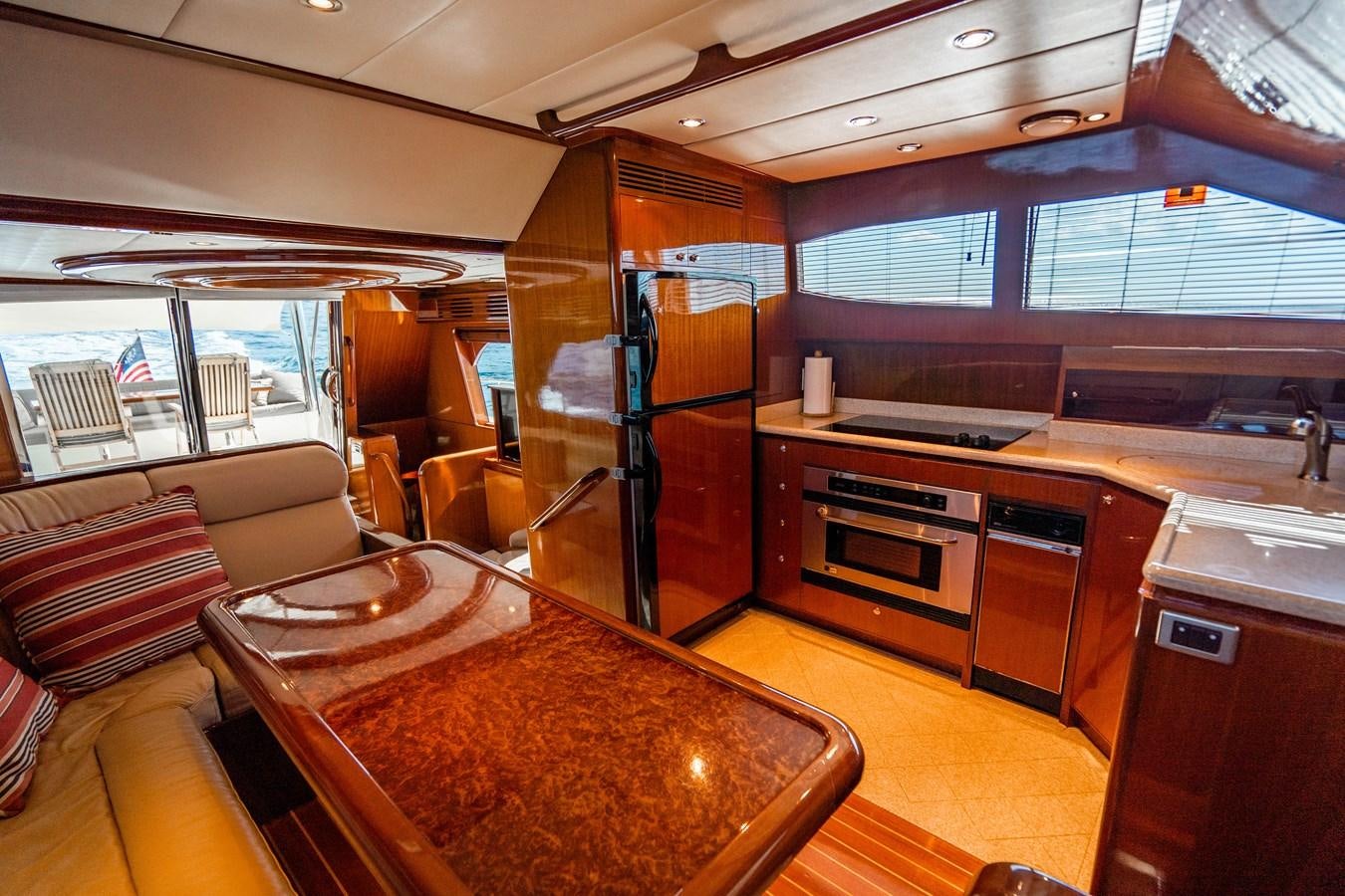 a kitchen with a table and a stove aboard Miss Penny Yacht for Sale