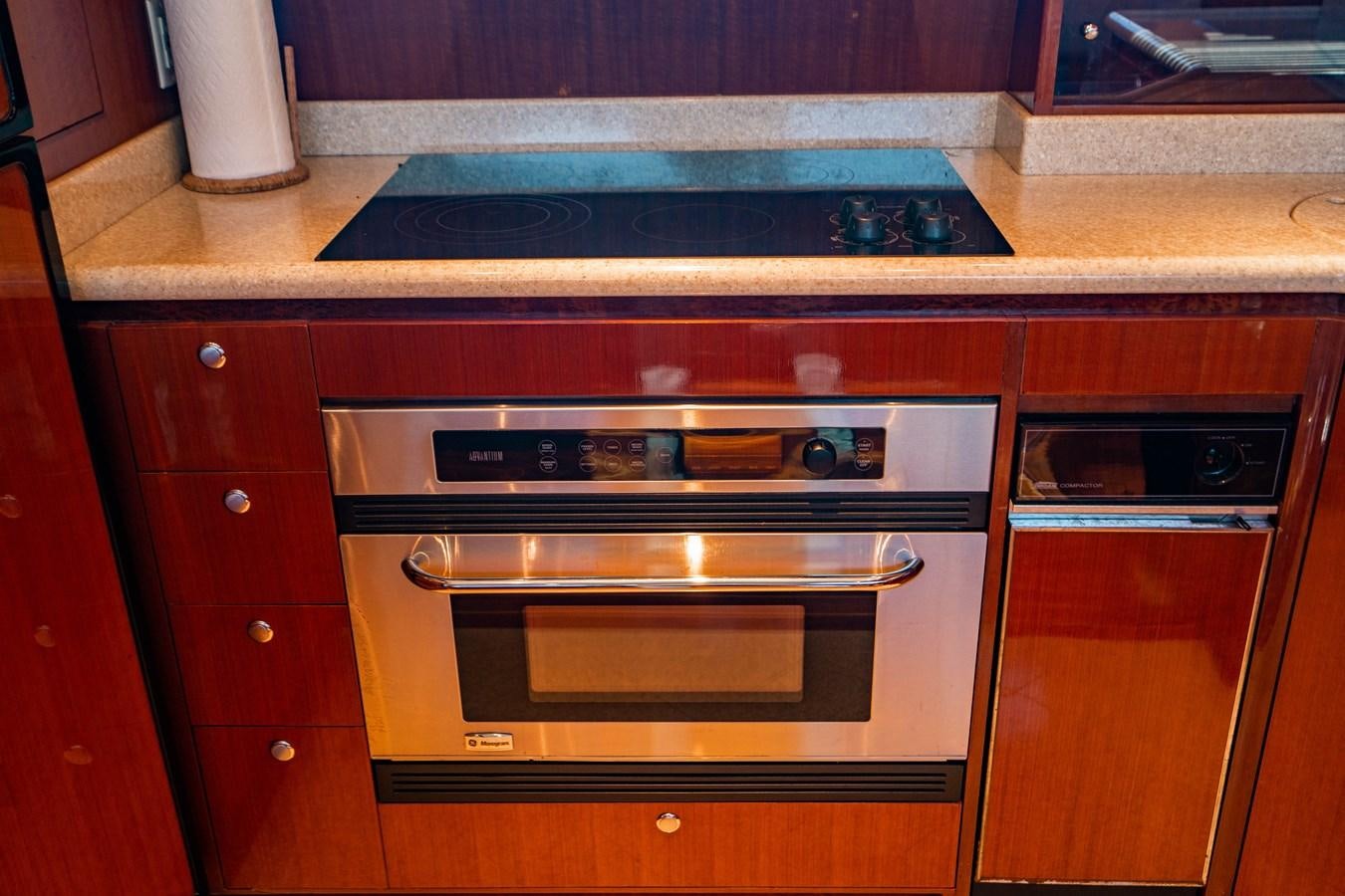 a kitchen with a stove and oven aboard Miss Penny Yacht for Sale