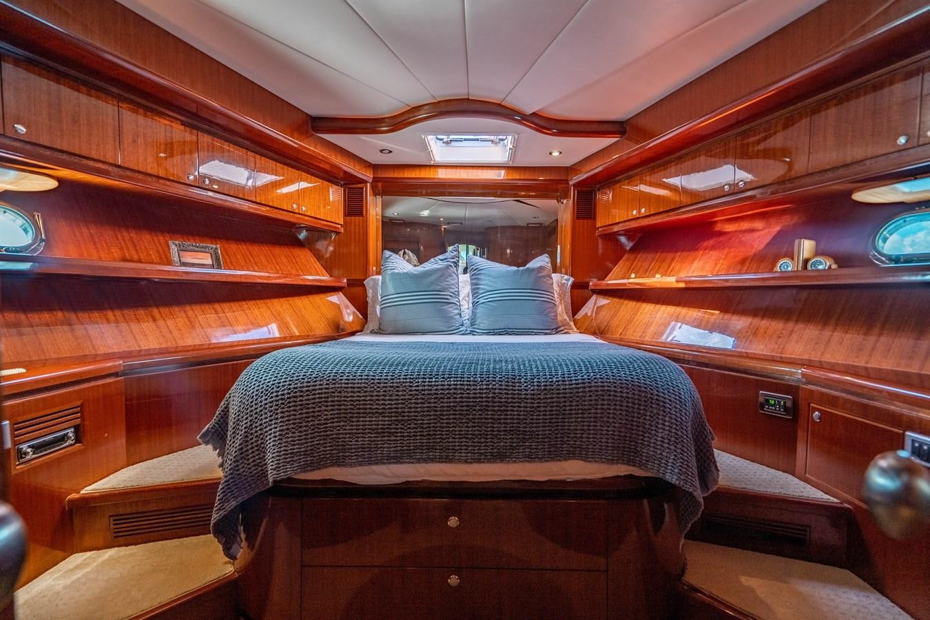 a cabin with a bed aboard Miss Penny Yacht for Sale