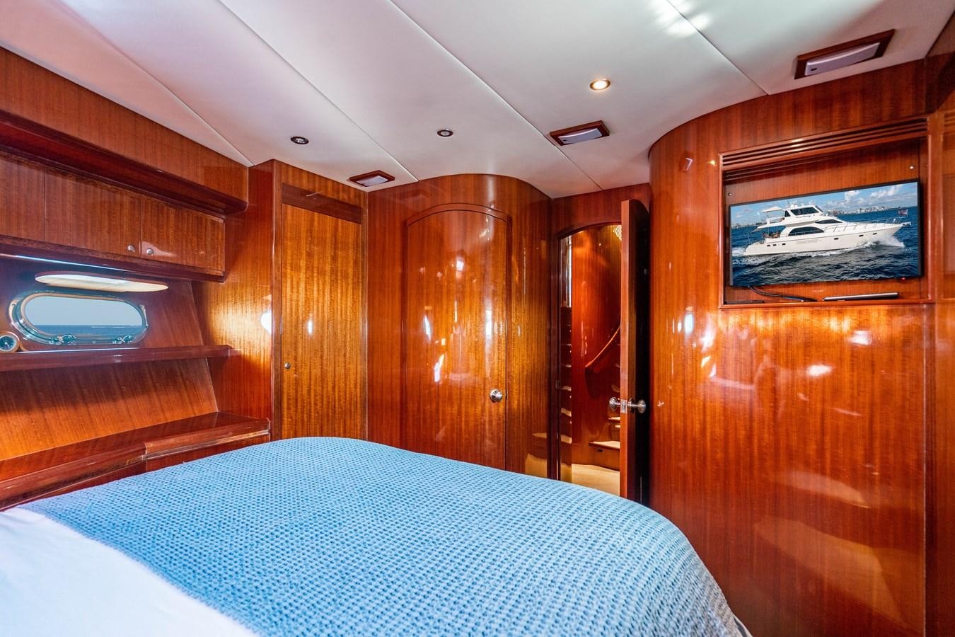 a cabin with a bed aboard Miss Penny Yacht for Sale