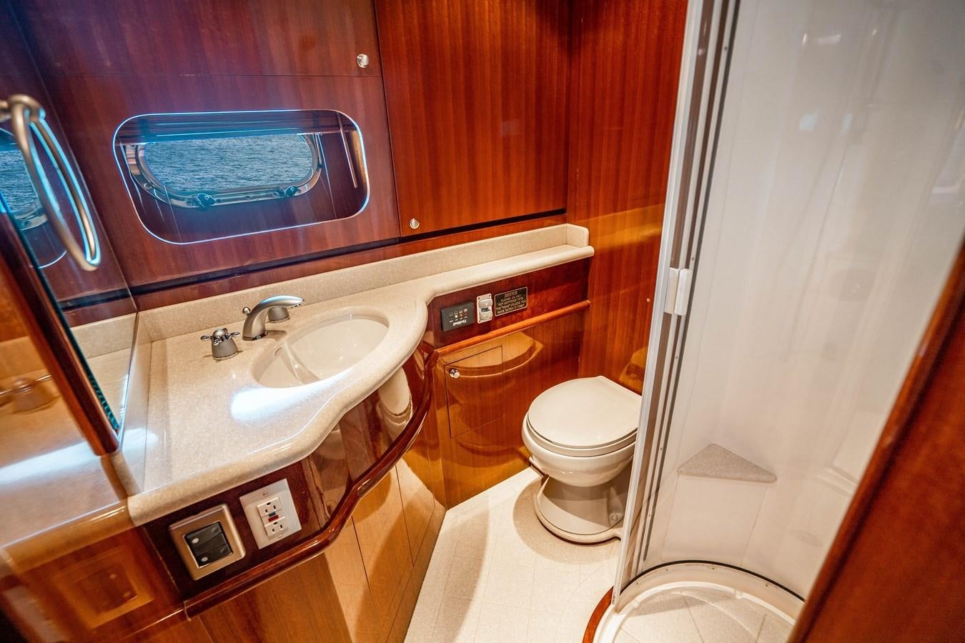 a bathroom with a sink and toilet aboard Miss Penny Yacht for Sale