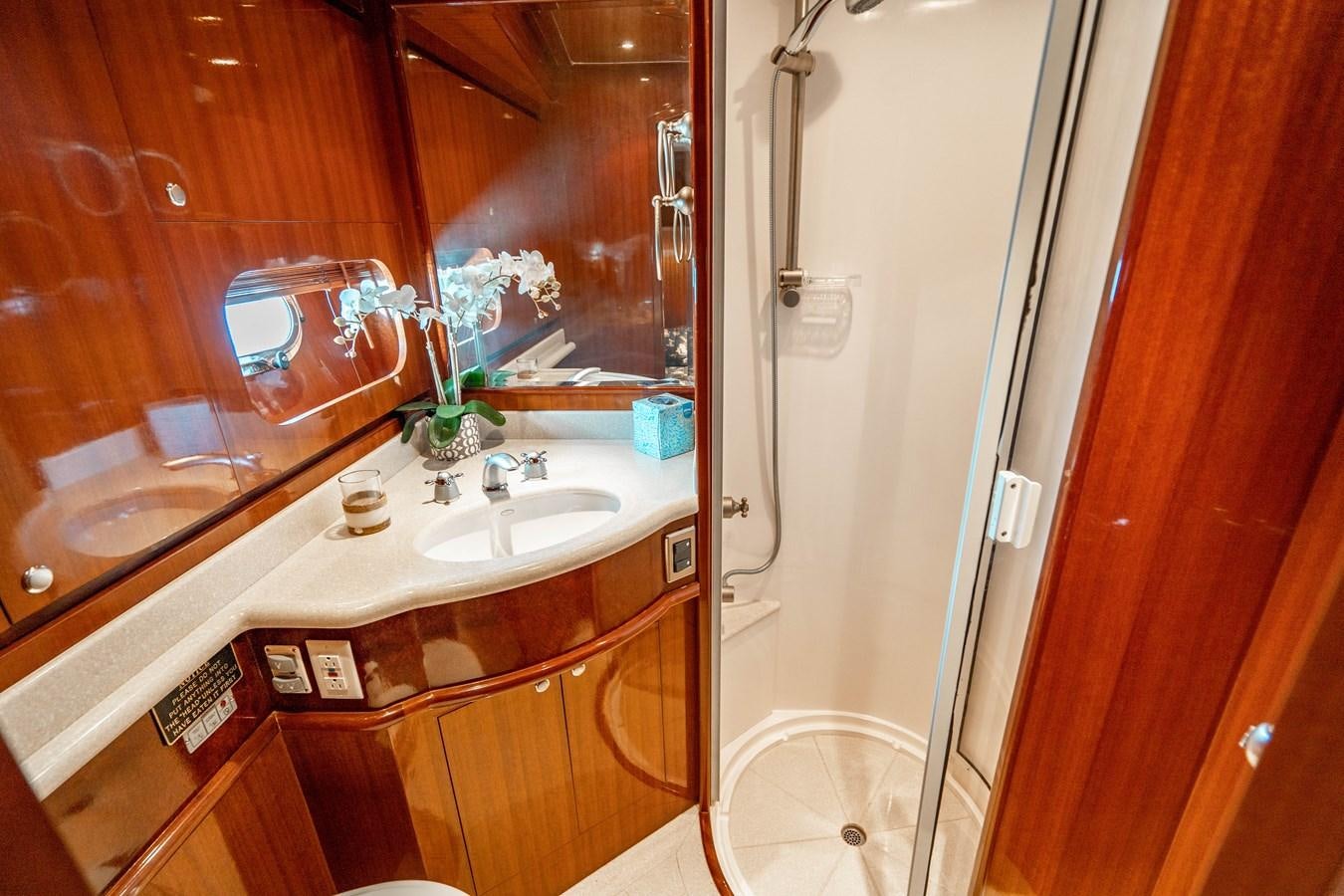 a bathroom with a large mirror aboard Miss Penny Yacht for Sale