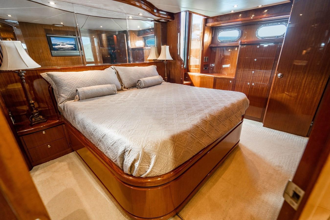a bed in a room aboard Miss Penny Yacht for Sale