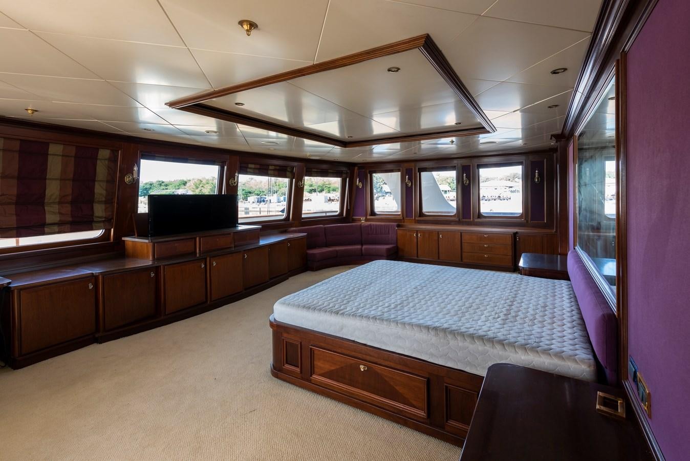 a room with a bed and a desk aboard BIG ARON Yacht for Sale