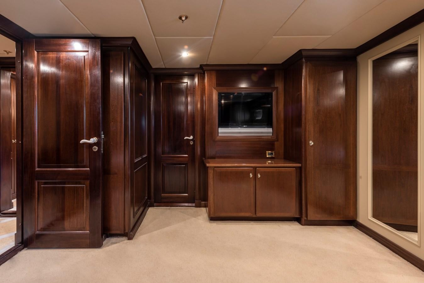 a room with wooden cabinets aboard BIG ARON Yacht for Sale