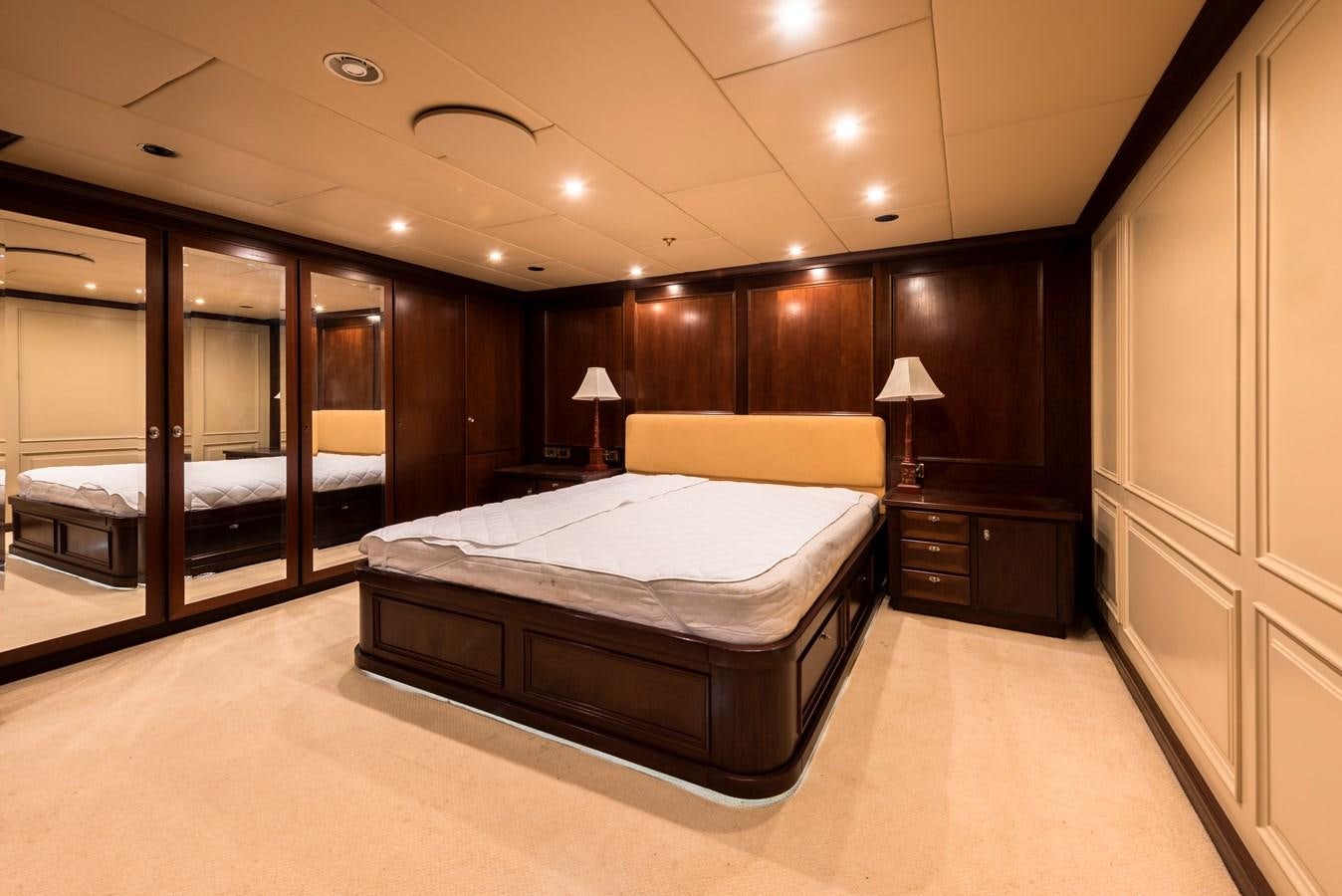 a large bedroom with a large bed aboard BIG ARON Yacht for Sale