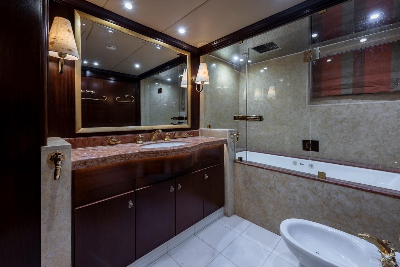 a bathroom with a large mirror aboard BIG ARON Yacht for Sale