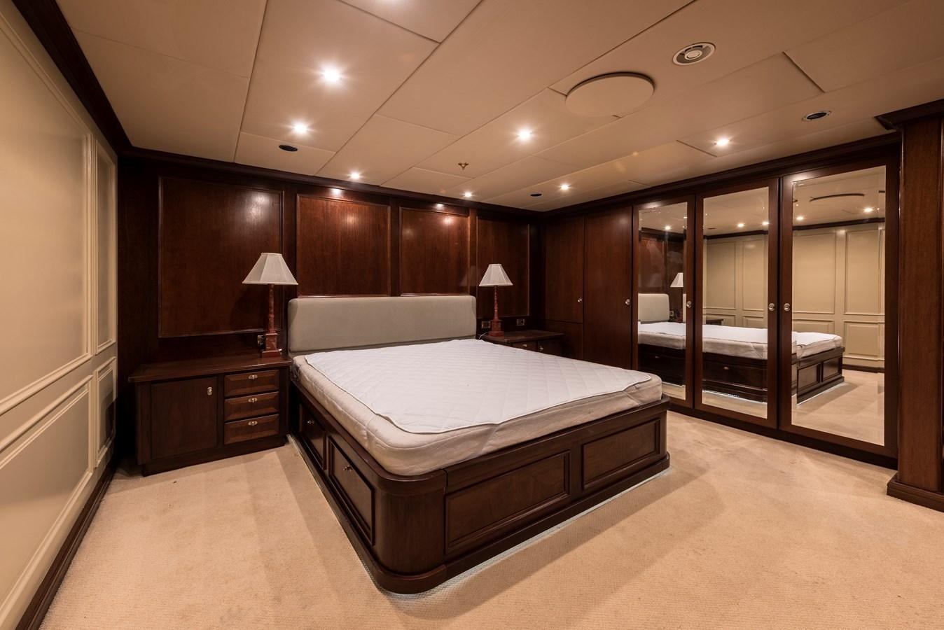 a large bedroom with a large bed aboard BIG ARON Yacht for Sale