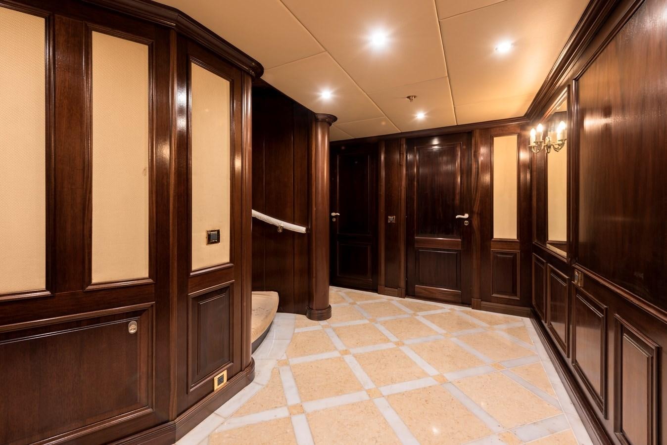 a room with a tile floor and cabinets aboard BIG ARON Yacht for Sale