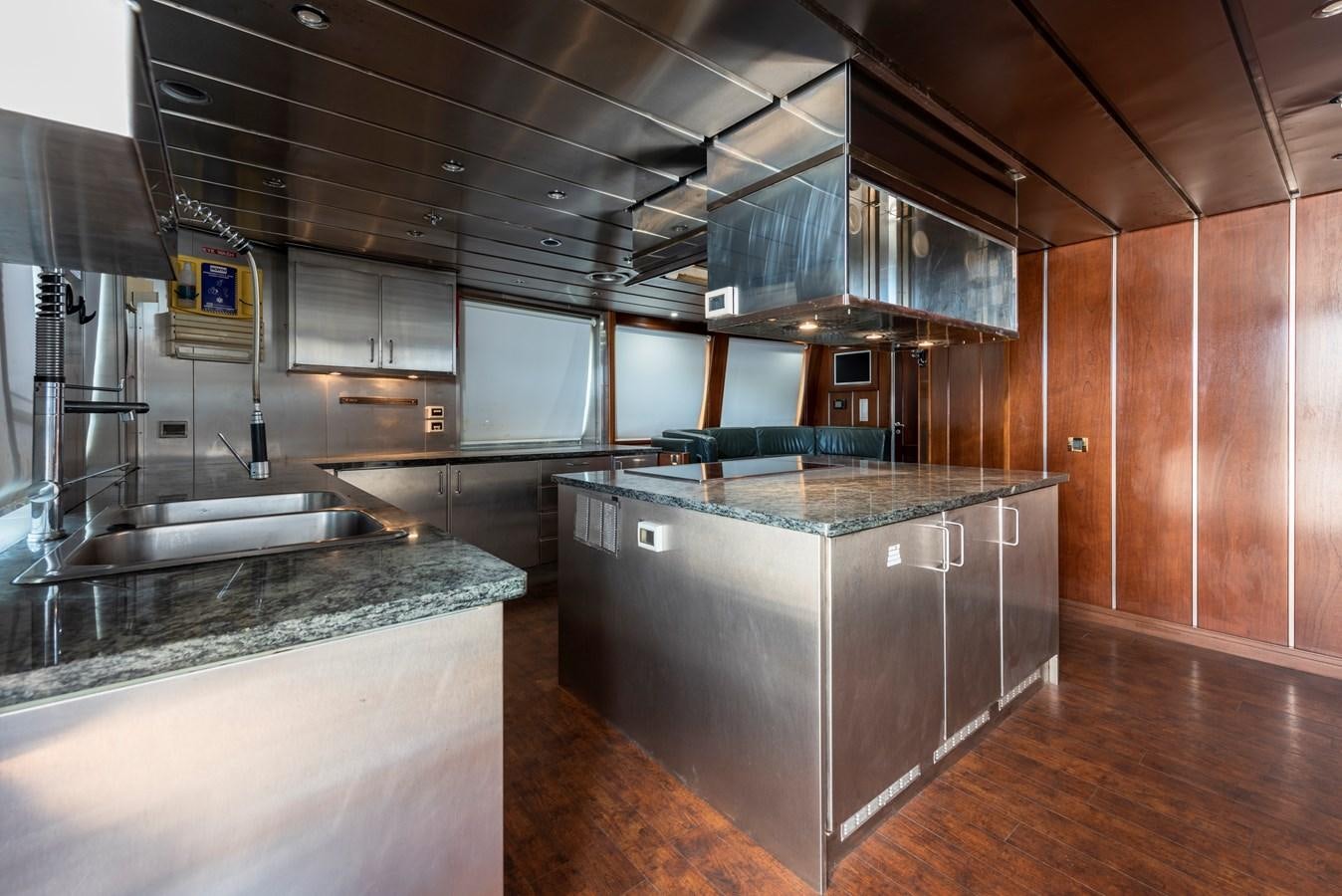 a kitchen with a large island aboard BIG ARON Yacht for Sale