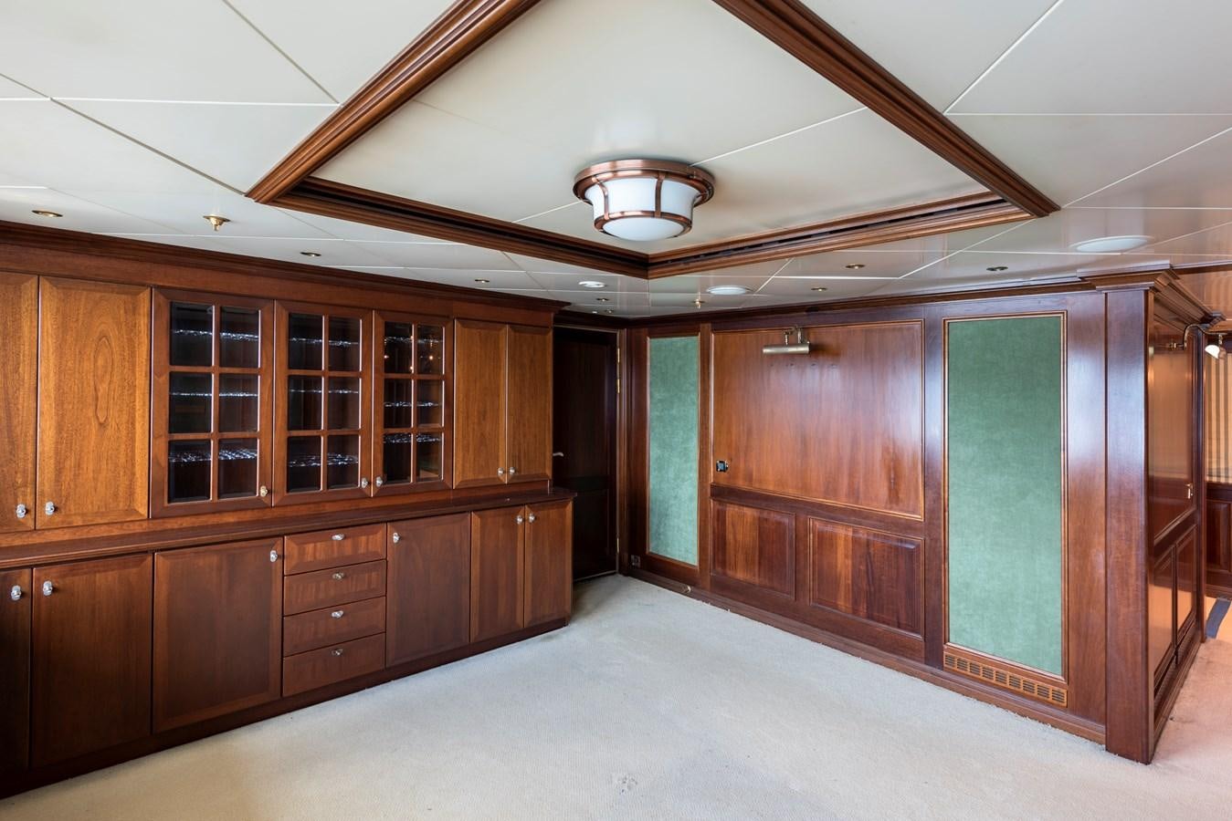a room with wooden cabinets aboard BIG ARON Yacht for Sale